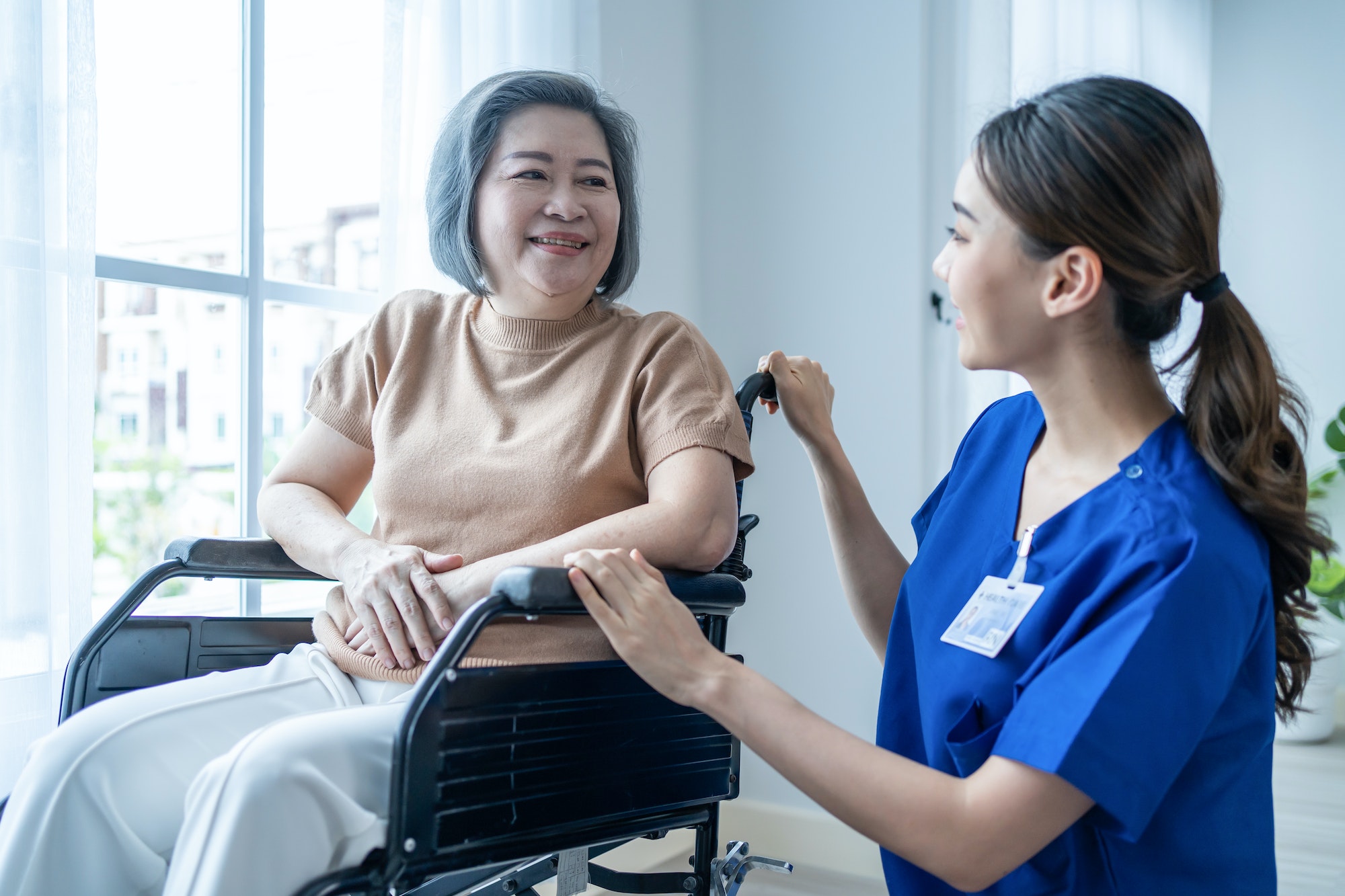 asian-nurse-take-care-senior-woman-on-wheelchair-at-nursing-home-care-.jpg